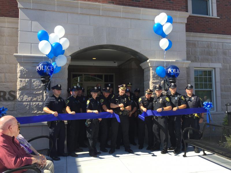 Dartmouth Police Chief Brian Levesque cuts the ribbon in the third ribbon-cutting ceremony to open the new headquarters on Tucker Road. Photos by: Kate Robinson